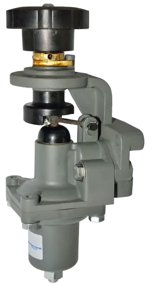 Gray industrial valve actuator with a black handwheel and metallic components.